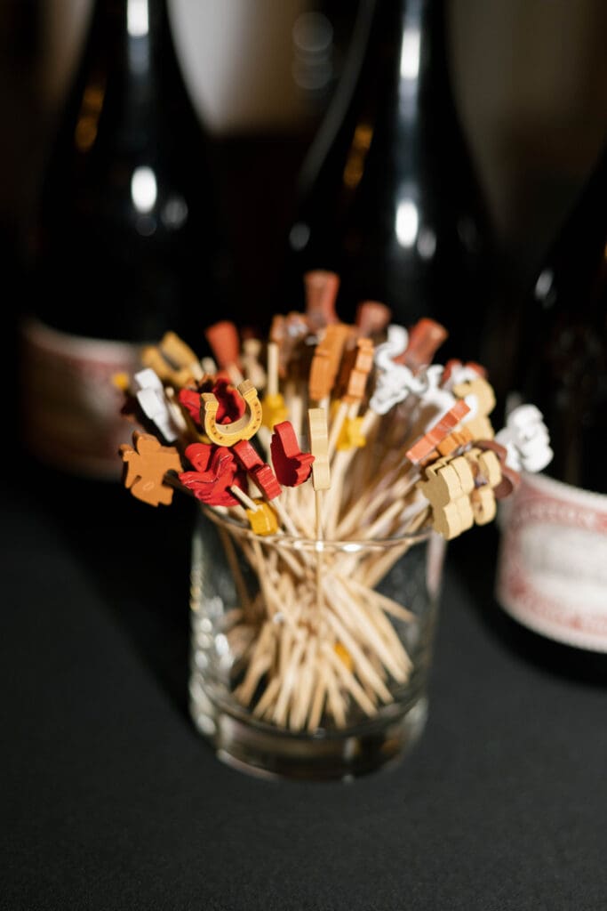 Texas themed drink stirrers in a glass